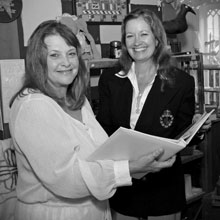 Barbara Warner and Connie Pyles focus on the wedding details at Over the Moon Events in Mount Dora.