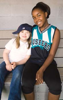 Anne-Marie Cyr (left) plays infield for the Red Sox with a little help from her buddy, Jasmin Thompson.