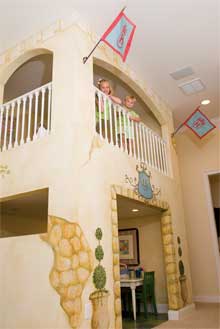 The faux stones and greenery lend to an old world theme while shades of browns, creams, and yellows blend nicely with the buttery walls of the rest of the playroom.