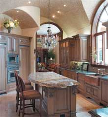 Neutral mosaic tile covers the ceiling of the open area kitchen. 