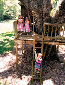 The Boyd children, Kimber (top left), Miranda, and Brady, spend plenty of time hanging out in their one-of-a-kind treehouse.