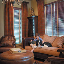 Owen Boone curls up with a good book next to the family dog, “Skootch,” in the Boone’s comfy study.