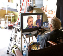 Director of Photography Flip Minott watches a scene with actor Joe Abby on monitor.