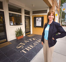 Elizabeth Scholl, standing here in front of the Historic State Theatre, is the Bay Street Players executive producer.