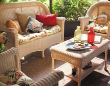 Kimberly turned the Arnold’s screened patio into a pleasant retreat to ensure Bill had more than one optimal seating preference. She added wicker indoor/outdoor seating picking up on green, red, and gold accessories.