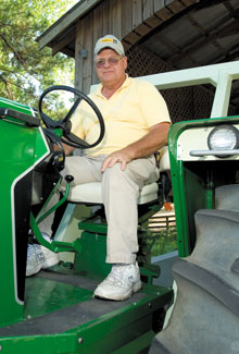 Michael seated aboard one of his fully restored 1972 Oliver 2255.