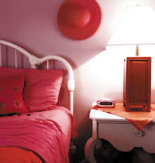 Orange and pink dresses older sister Marissa’s bedroom.